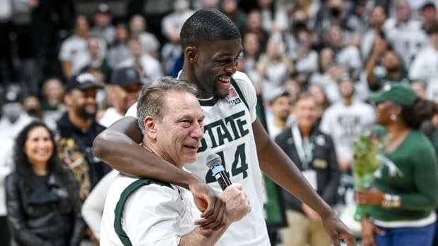 Michigan State's head coach Tom Izzo, left, talks about Gabe Brown during a senior night ceremony after the game against Maryland on Sunday, March 6, 2022, at the Breslin Center.